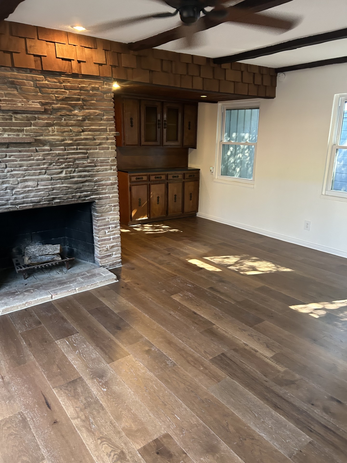 1922 Vassar Street Houston, TX 77098 - Photo 12 of 27 a view of an empty room with a fireplace and a window