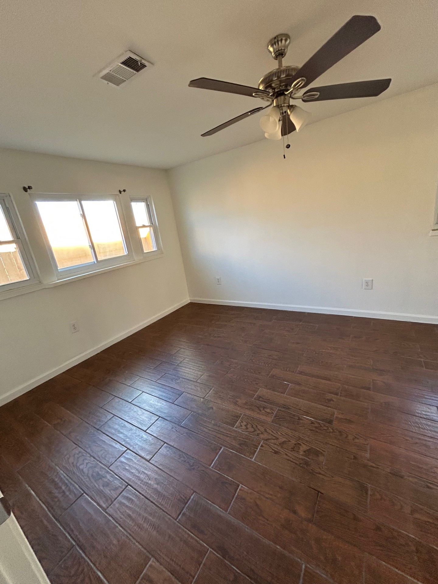 1922 Vassar Street Houston, TX 77098 - Photo 15 of 27 wooden floor in an empty room with a window