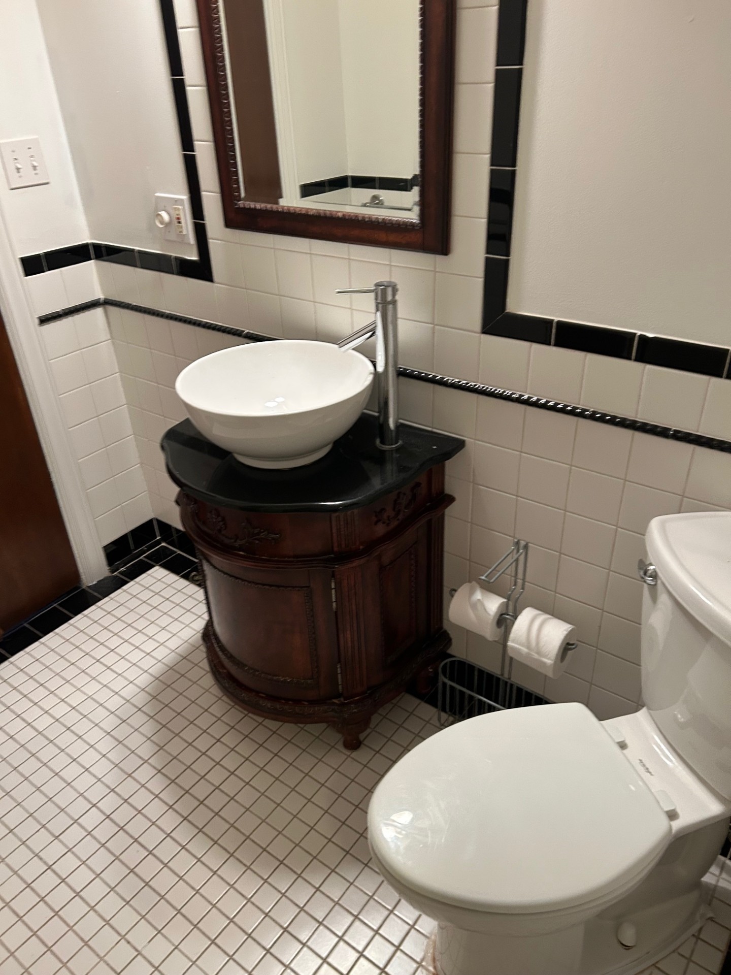 1922 Vassar Street Houston, TX 77098 - Photo 18 of 27 a bathroom with a toilet a sink and mirror