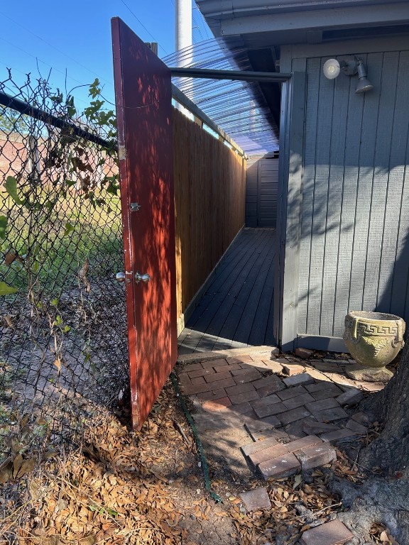 1922 Vassar Street Houston, TX 77098 - Photo 22 of 27 View from driveway into the back walkway. At the end of the walkway are the stacked washer & dryer units.