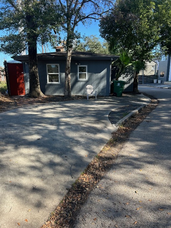 1922 Vassar Street Houston, TX 77098 - Photo 5 of 27 Driveway for 1922 Vassar. Red door on the left is a back door to a walkway on the property and sliding glass doors to the living room.