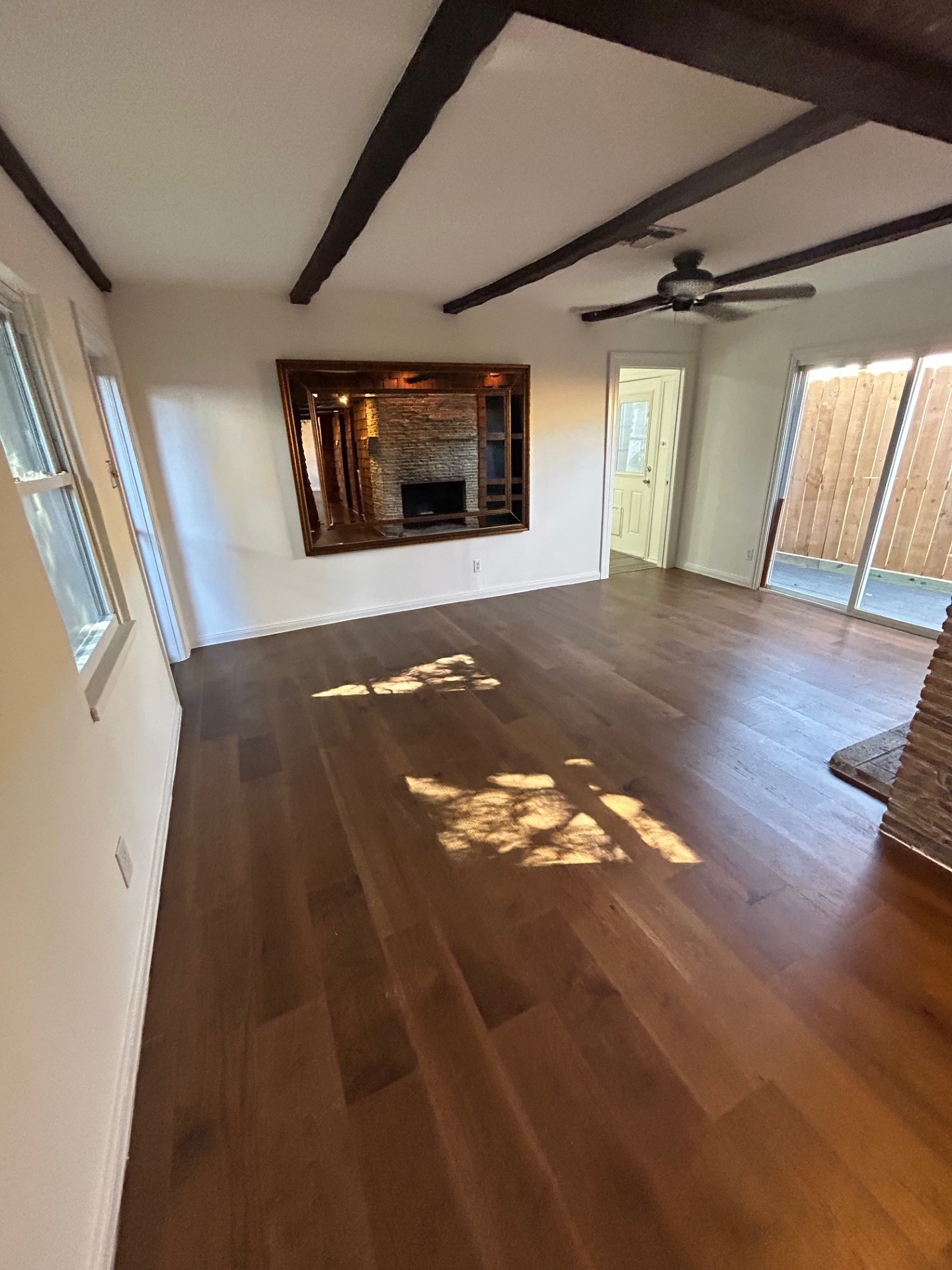 1922 Vassar Street Houston, TX 77098 - Photo 9 of 27 a view of an empty room with wooden floor and windows