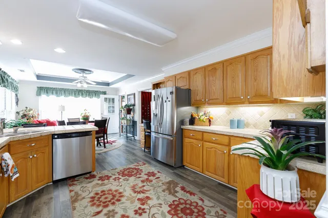 a kitchen with sink and refrigerator