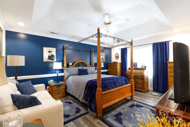 a bed room with bed and mirror