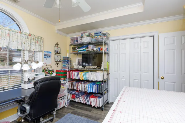 a bedroom with furniture and a window