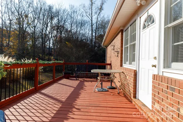 a balcony with furniture and a garden