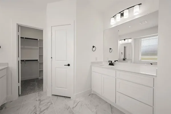 a bathroom with a bathtub and sink