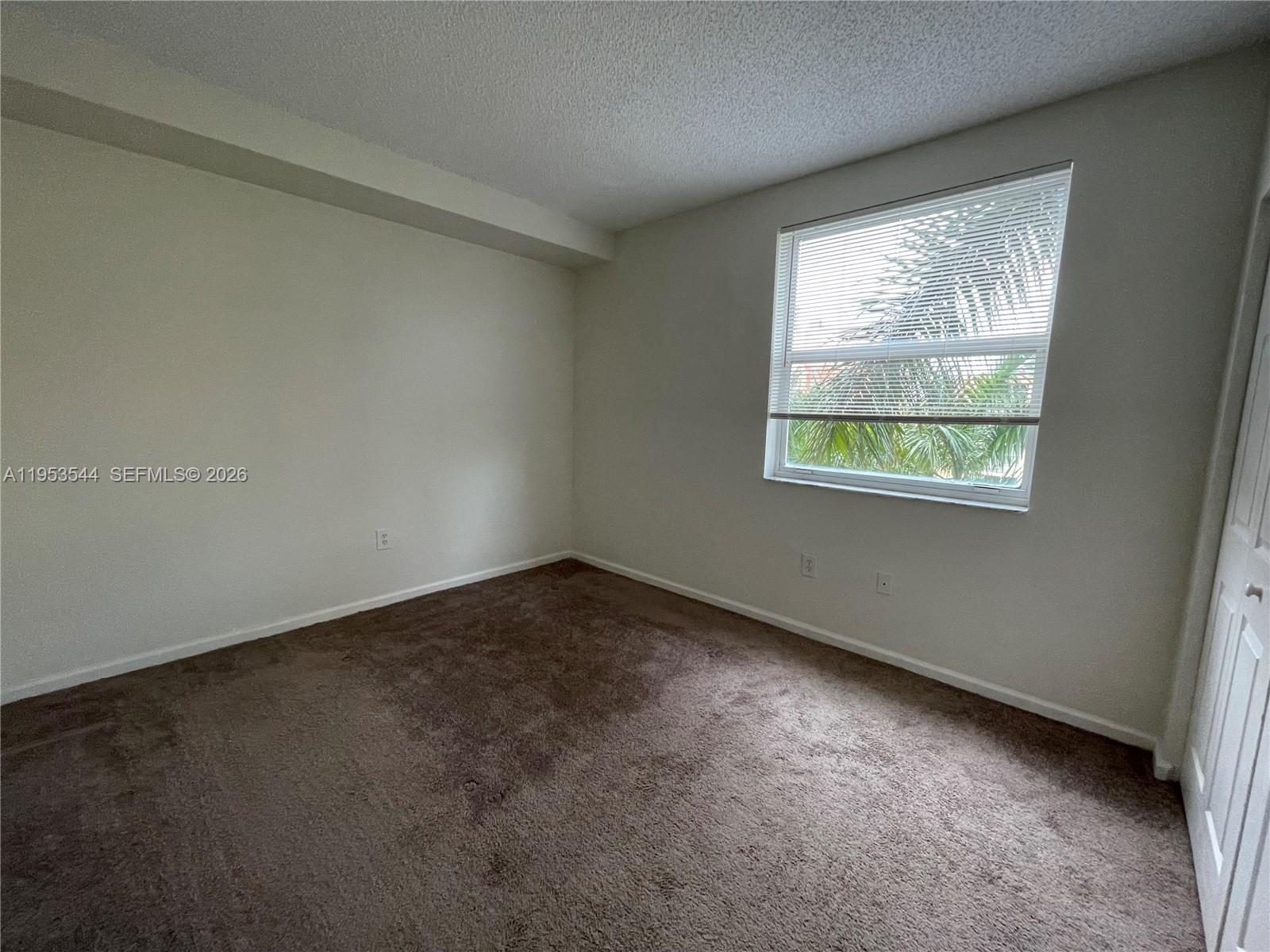 17125 North Bay Road, Unit 3404 Sunny Isles Beach, FL 33160 - Photo 14 of 20 an empty room with a window