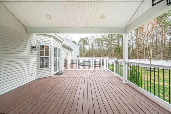 a view of a balcony with wooden floor