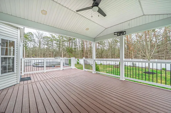 a view of a balcony with wooden floor