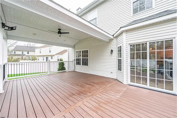 a view of outdoor space with wooden floor and fence
