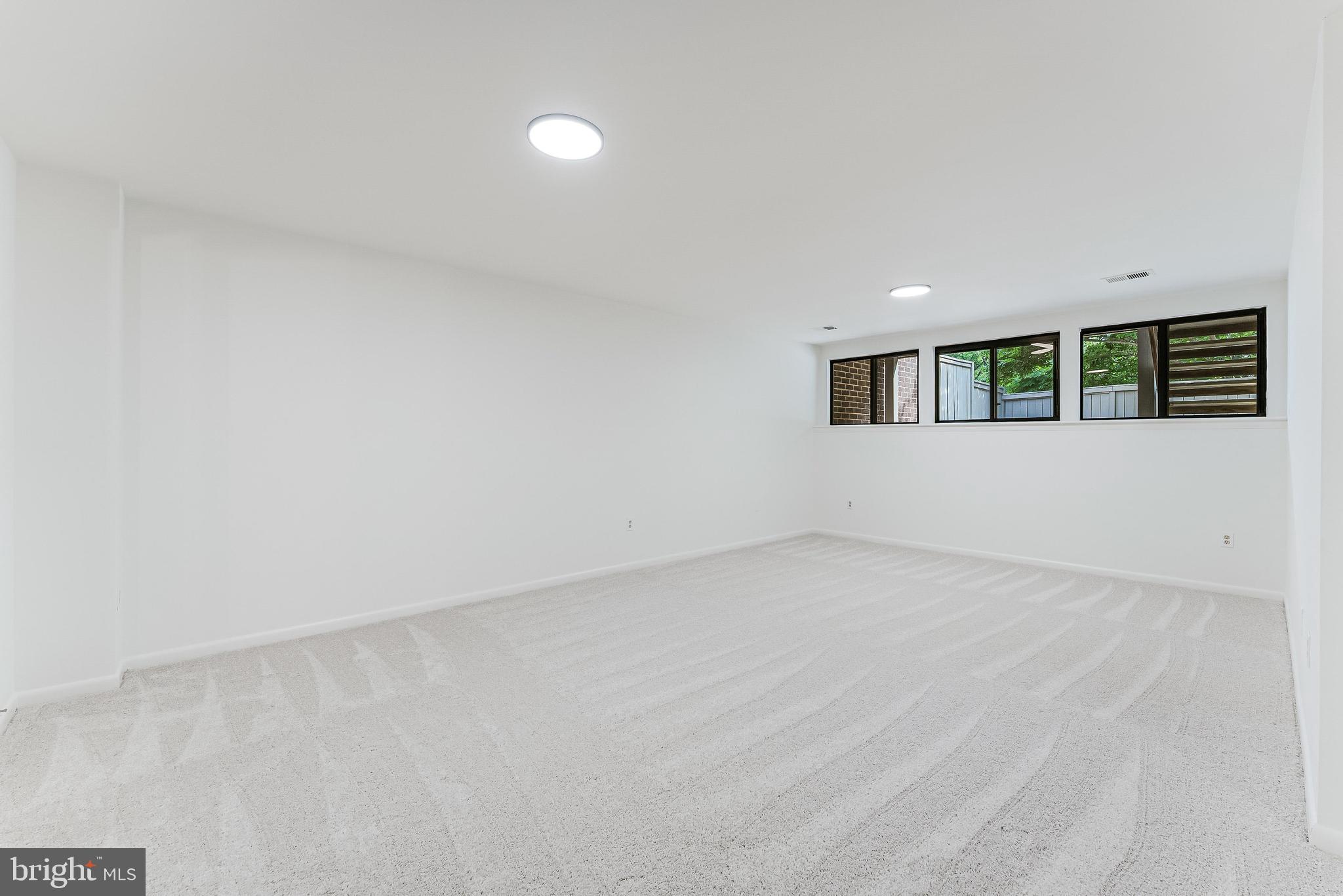 12023 Insha Court Reston, VA 20191 - Photo 8 of 52 a view of an empty room with a window