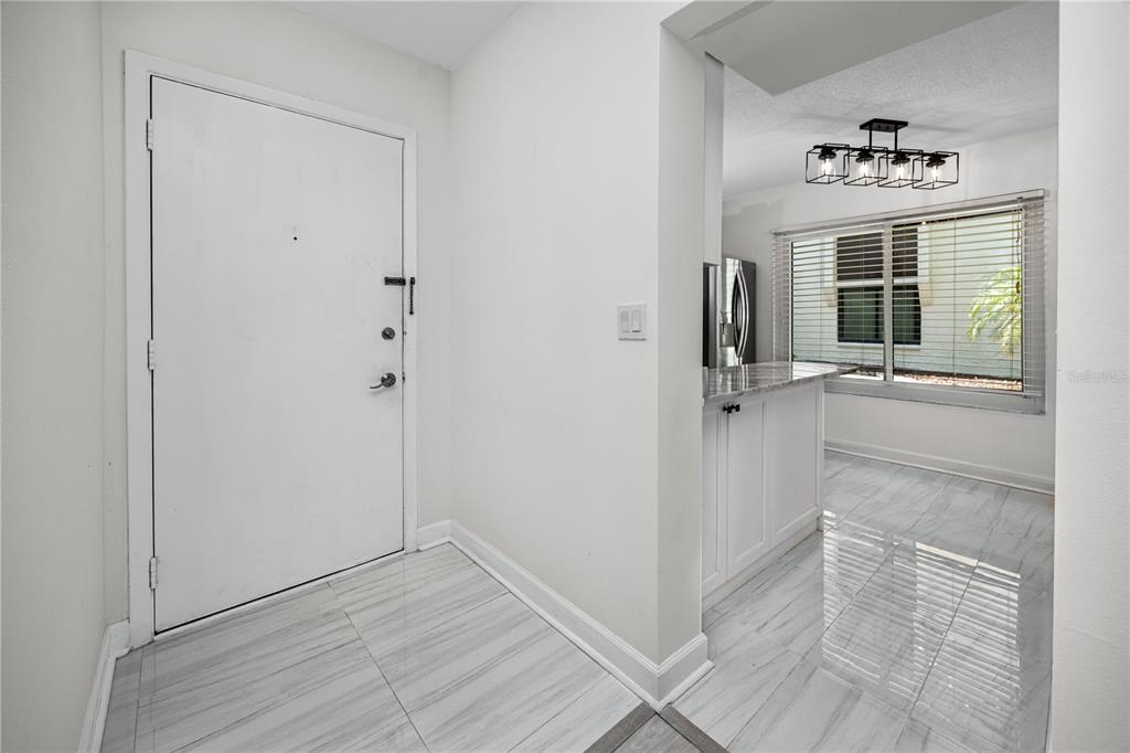 2207 Belleair Road, Unit B4 Clearwater, FL 33764 - Photo 24 of 37 wooden floor in an empty room