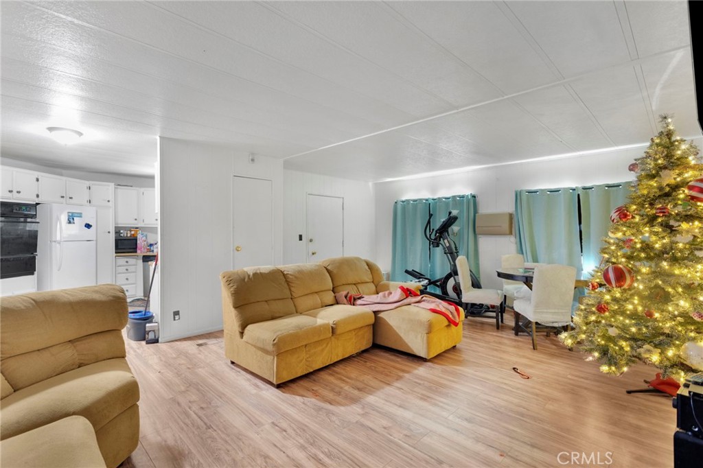 19044 Joshua Street Adelanto, CA 92301 - Photo 13 of 34 a living room with furniture and a large window