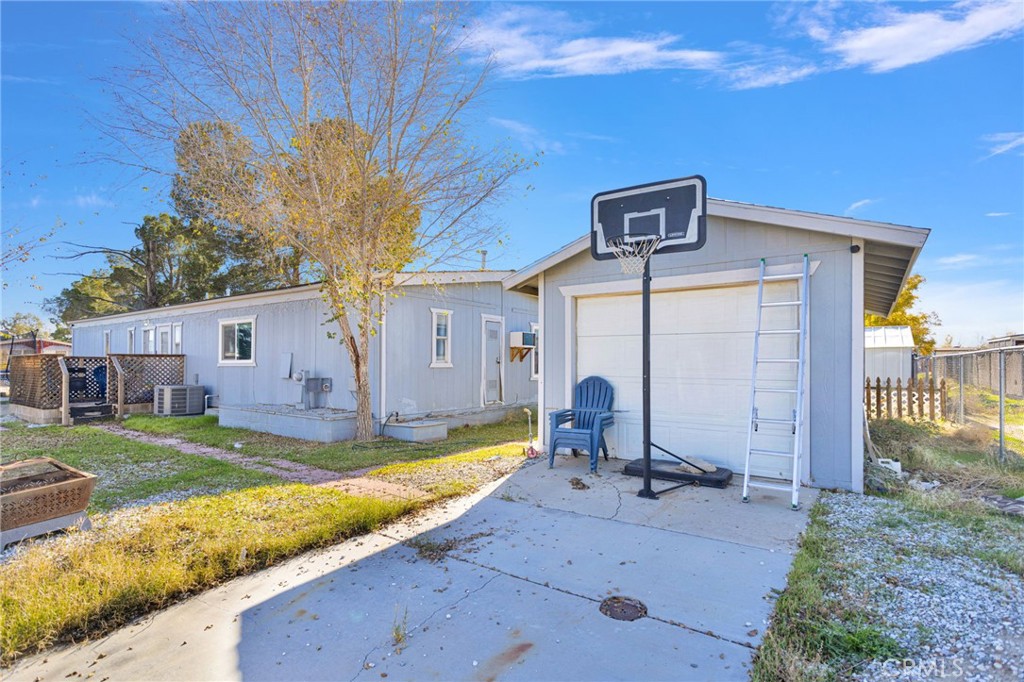 19044 Joshua Street Adelanto, CA 92301 - Photo 19 of 34 a view of a house with backyard and sitting area