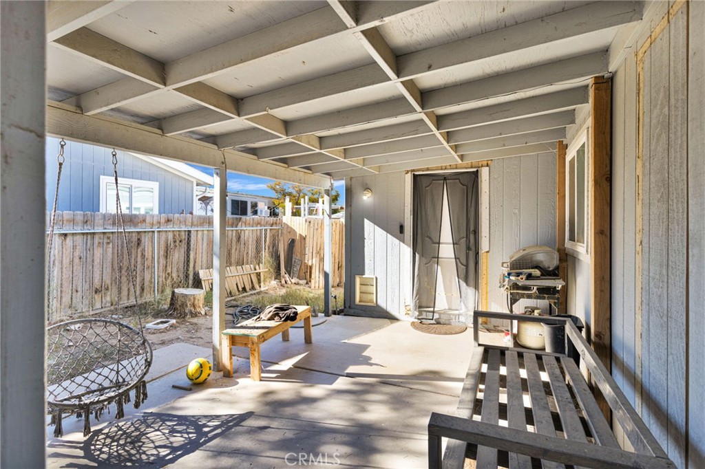 19044 Joshua Street Adelanto, CA 92301 - Photo 2 of 34 a hallway with wooden floor and furniture