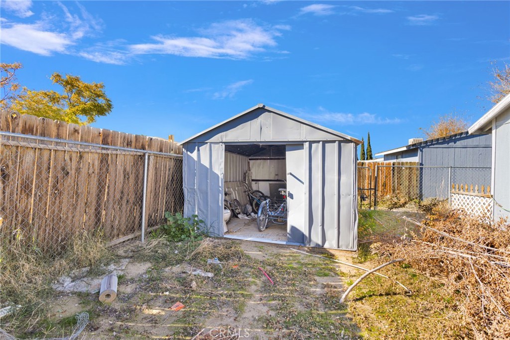 19044 Joshua Street Adelanto, CA 92301 - Photo 22 of 34 a front view of a house with garden