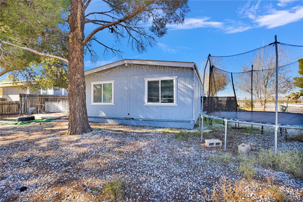 19044 Joshua Street Adelanto, CA 92301 - Photo 5 of 34 a view of a house with a yard