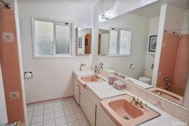 a bathroom with a sink vanity tub and shower