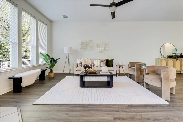 a living room with furniture and a large window
