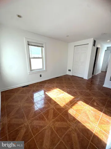 a bathroom with a toilet a sink a mirror and bathtub