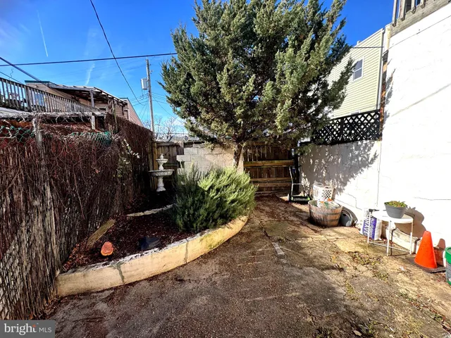 a view of a pathway with a house in the background