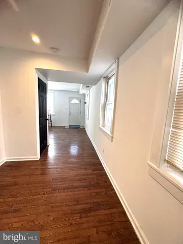 a view of gallery with wooden floor