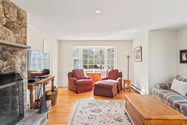 a bathroom with double vanity sink a toilet and a mirror