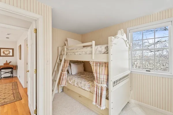 a bedroom with a bed and a night stand