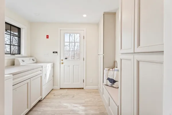 a living room with furniture rug and window
