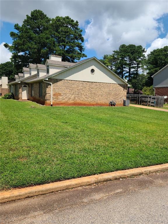 2120 Fieldstone View Court Southeast Conyers, GA 30013 - Photo 1 of 12 a backyard of a house with lots of green space