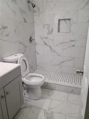 a bathroom with a toilet and a sink