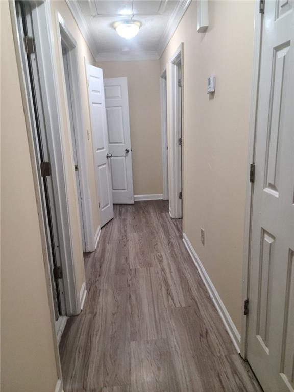 2120 Fieldstone View Court Southeast Conyers, GA 30013 - Photo 12 of 12 a view of a hallway with wooden floor and a glass door