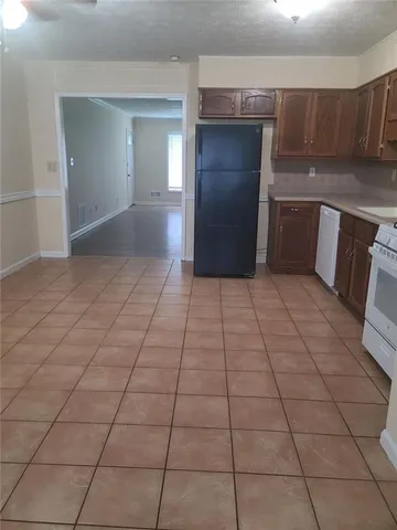 a view of a utility room and empty room