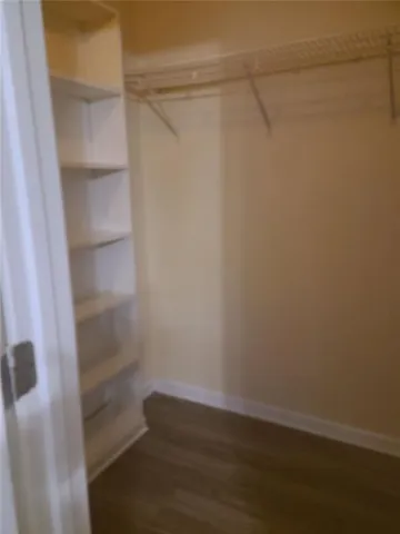 a view of an empty walk in closet
