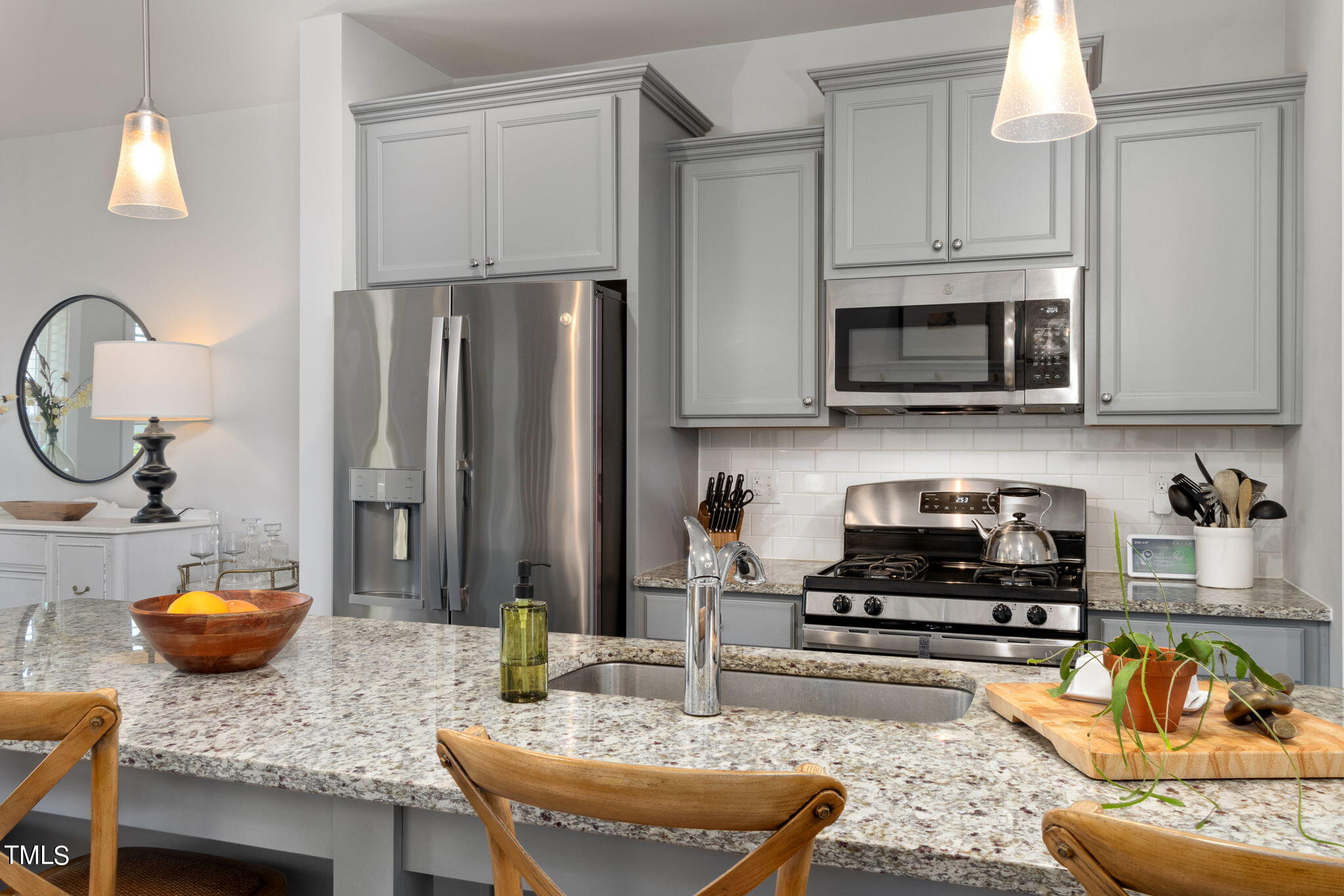 269 Douglas Falls Drive Wendell, NC 27591 - Photo 12 of 51 a kitchen with a stove a sink and a refrigerator