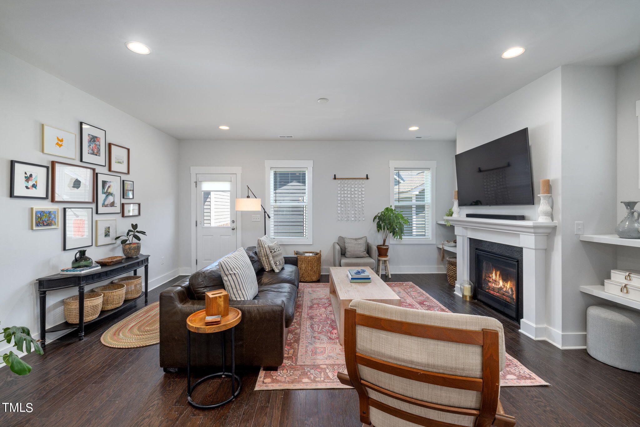 269 Douglas Falls Drive Wendell, NC 27591 - Photo 14 of 51 a living room with furniture fireplace and flat screen tv