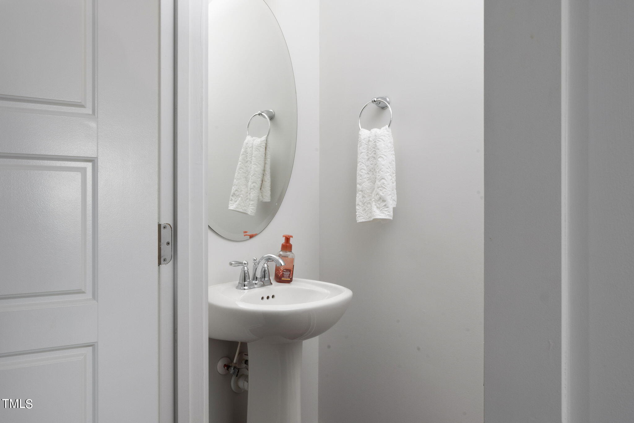 269 Douglas Falls Drive Wendell, NC 27591 - Photo 22 of 51 a bathroom with a sink and a mirror