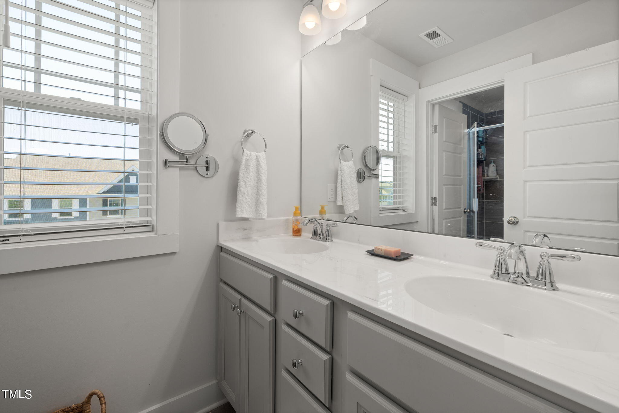 269 Douglas Falls Drive Wendell, NC 27591 - Photo 27 of 51 a bathroom with a sink and a mirror