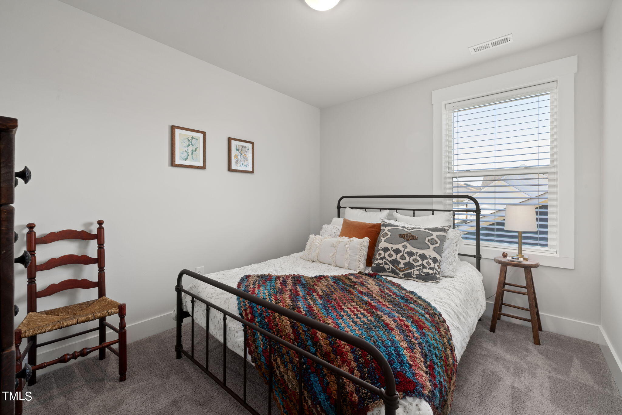 269 Douglas Falls Drive Wendell, NC 27591 - Photo 30 of 51 a bedroom with a bed and a chair