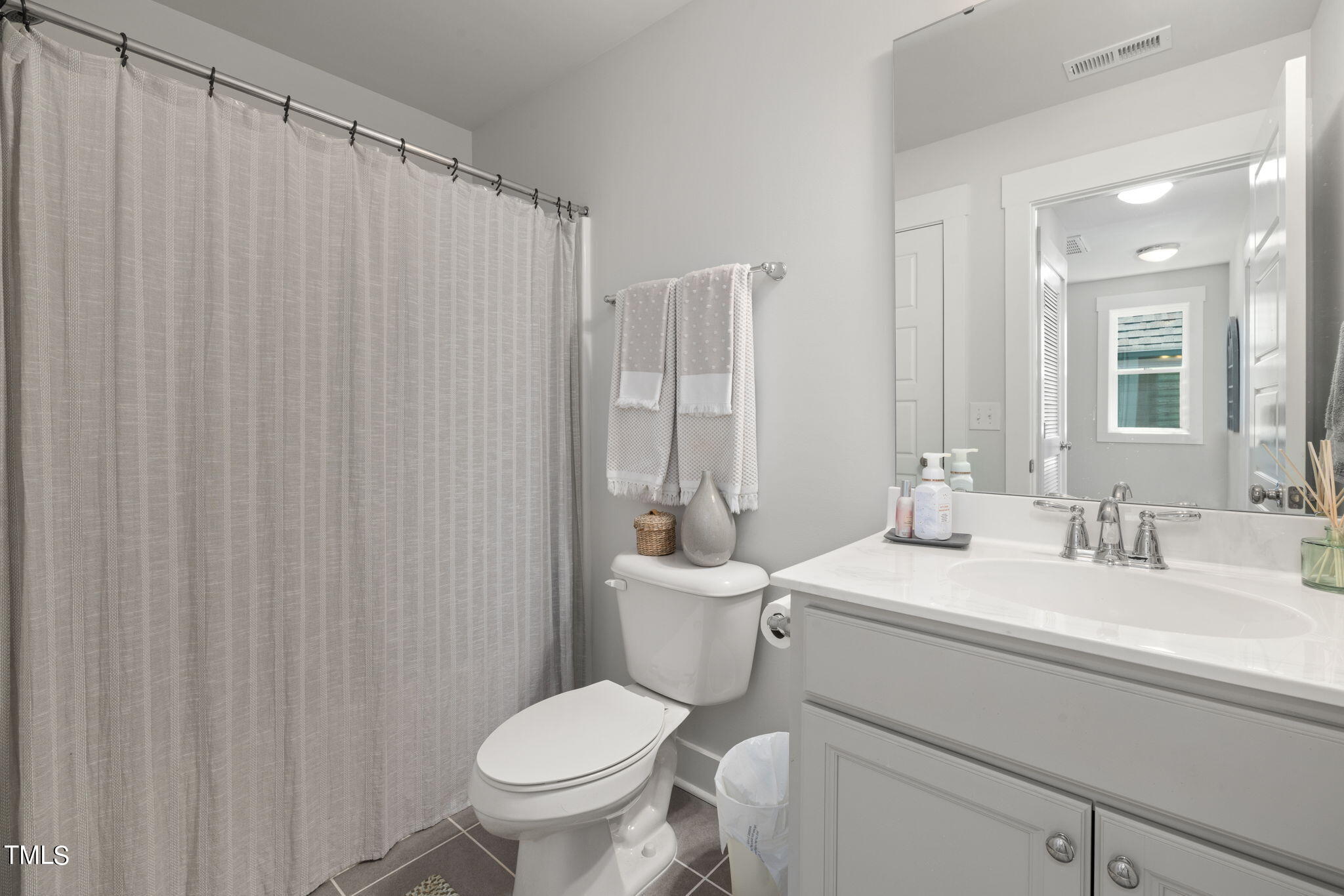 269 Douglas Falls Drive Wendell, NC 27591 - Photo 31 of 51 a bathroom with a toilet a sink and a shower