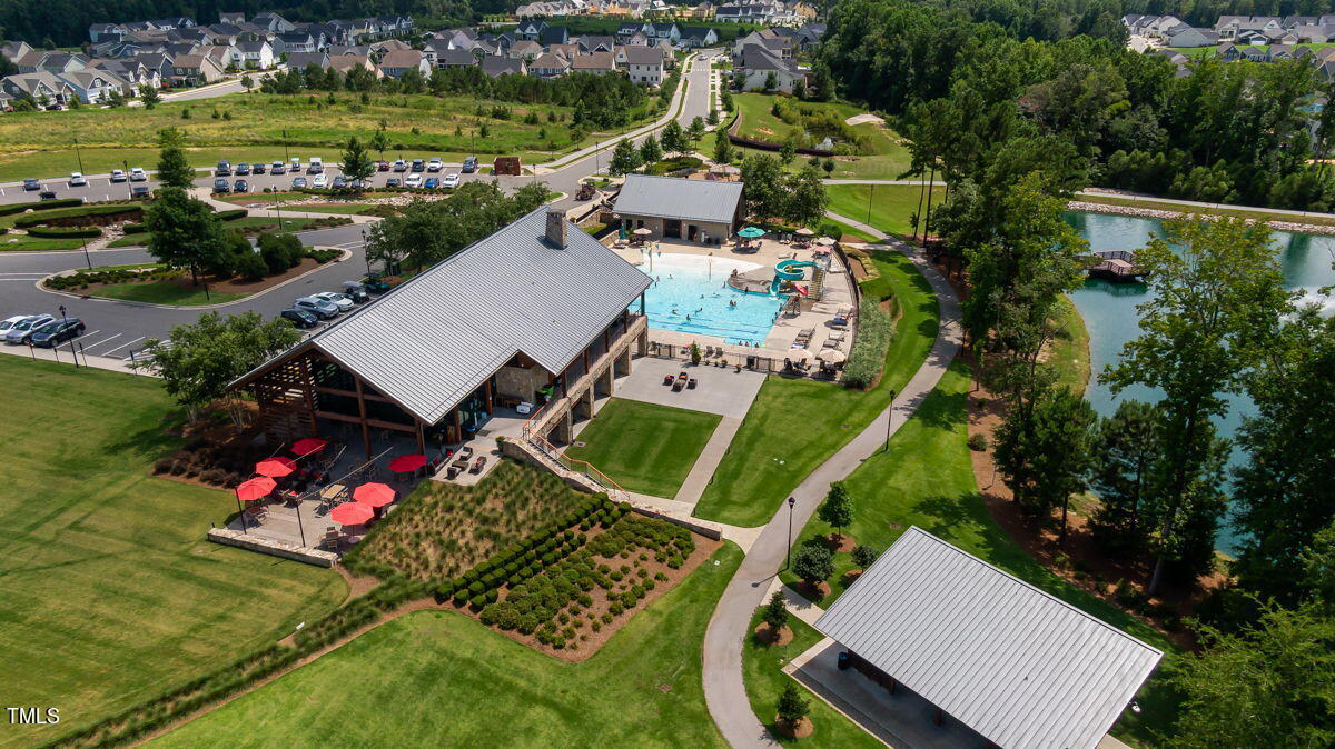 269 Douglas Falls Drive Wendell, NC 27591 - Photo 38 of 51 an aerial view of a house with a garden and lake view