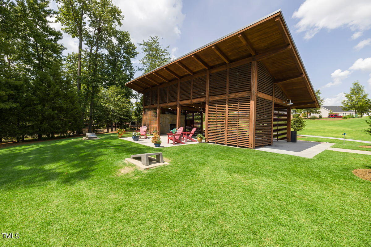 269 Douglas Falls Drive Wendell, NC 27591 - Photo 40 of 51 a backyard of a house with table and chairs
