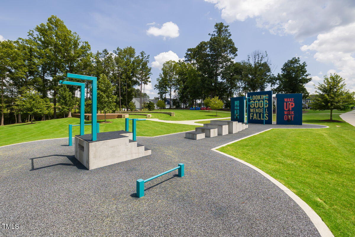 269 Douglas Falls Drive Wendell, NC 27591 - Photo 41 of 51 a swimming pool with outdoor seating and yard