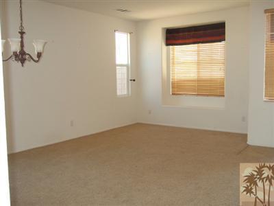 37243 Haweswater Road Indio, CA 92203 - Photo 2 of 14 an empty room with windows