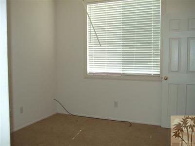 37243 Haweswater Road Indio, CA 92203 - Photo 4 of 14 an empty room with a window