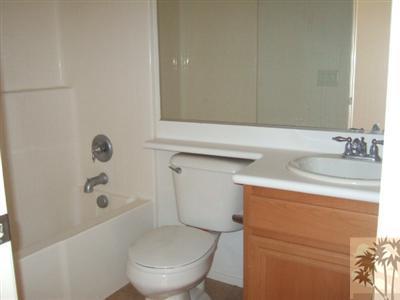 37243 Haweswater Road Indio, CA 92203 - Photo 9 of 14 a bathroom with a sink a toilet and shower