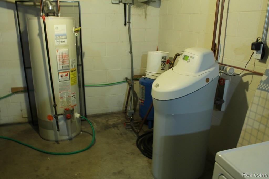 6544 General Squier Road Almont, MI 48003 - Photo 38 of 53 Basement area. Hot water heater is gas. Softener is owned and stays.