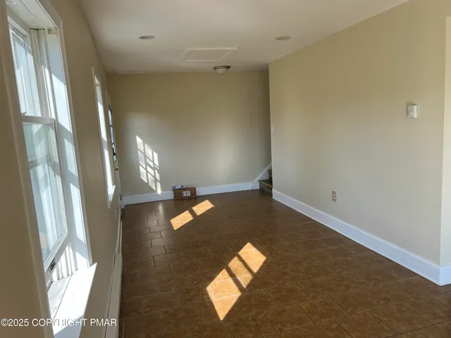 a kitchen with stainless steel appliances granite countertop a refrigerator stove microwave and sink