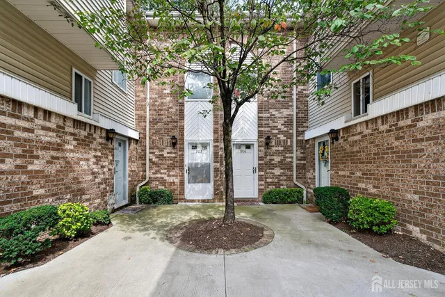 a view of a pathway both side of house